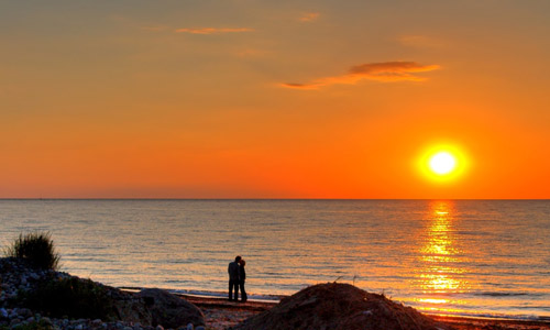 100 Ways To Be Romantic - Watch The Sun Setting Together.