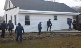 80 People Just Moved A House Into Place. They Literally Pick It Up And Move It.